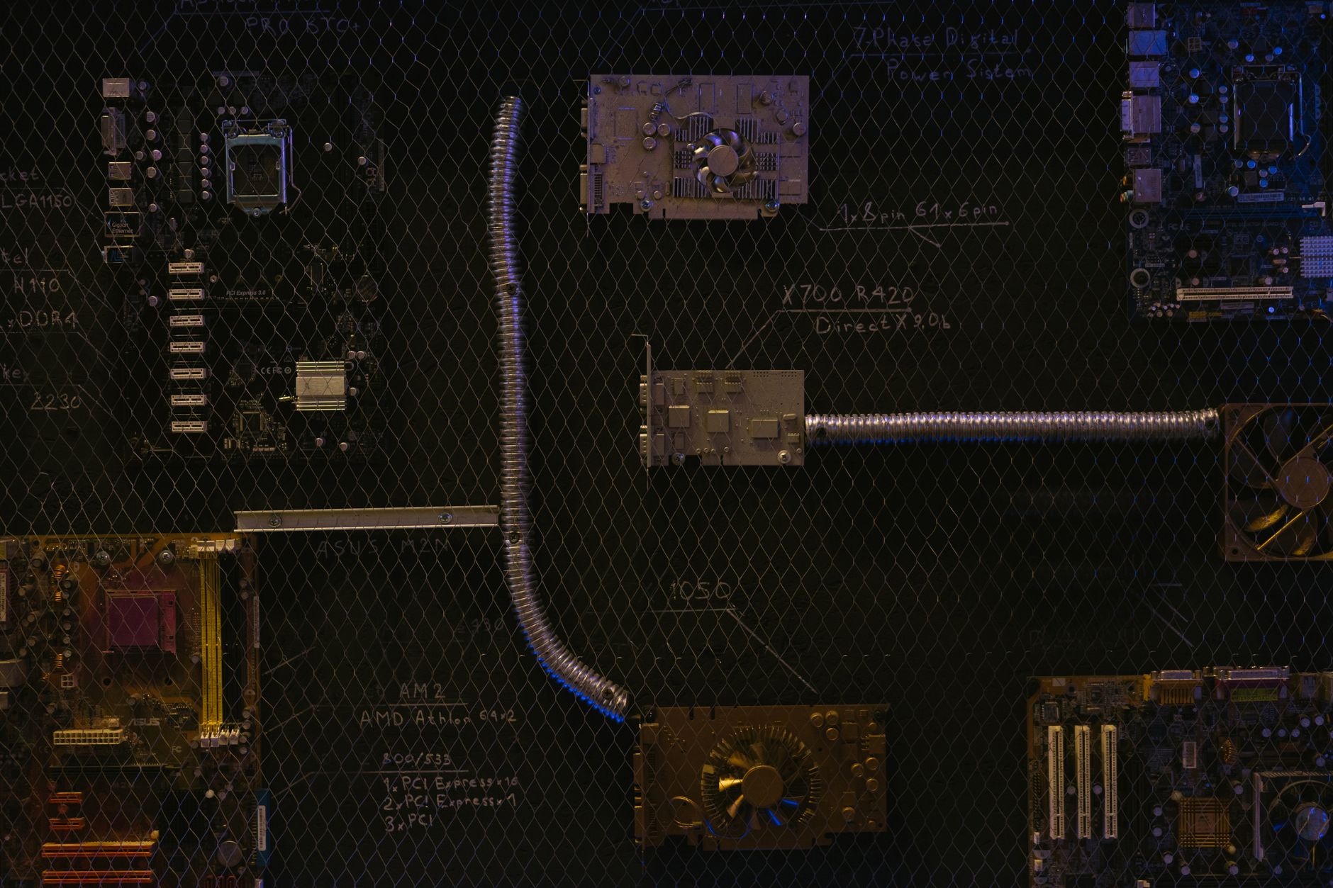 Artistic arrangement of circuit boards and cables symbolizes modern technology.